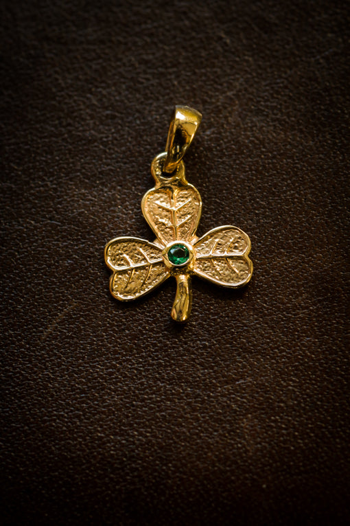 gold shamrock pendant with emerald